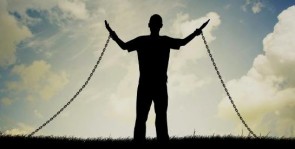 a-man-lifts-his-arms-in-praise-even-though-he-is-in-chains_rmo5CAZgC-e1512896949686